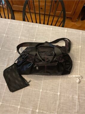 bebe Black Travel Duffle with Pink Accent Stitching